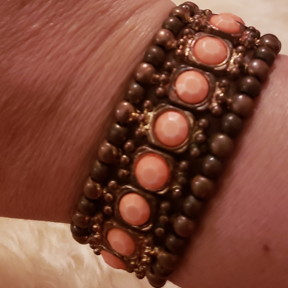Coral and brass colored bracelet